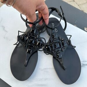 Aldo Black Beaded Flat Sandals. never worn. Leather strap around ankle. size 7